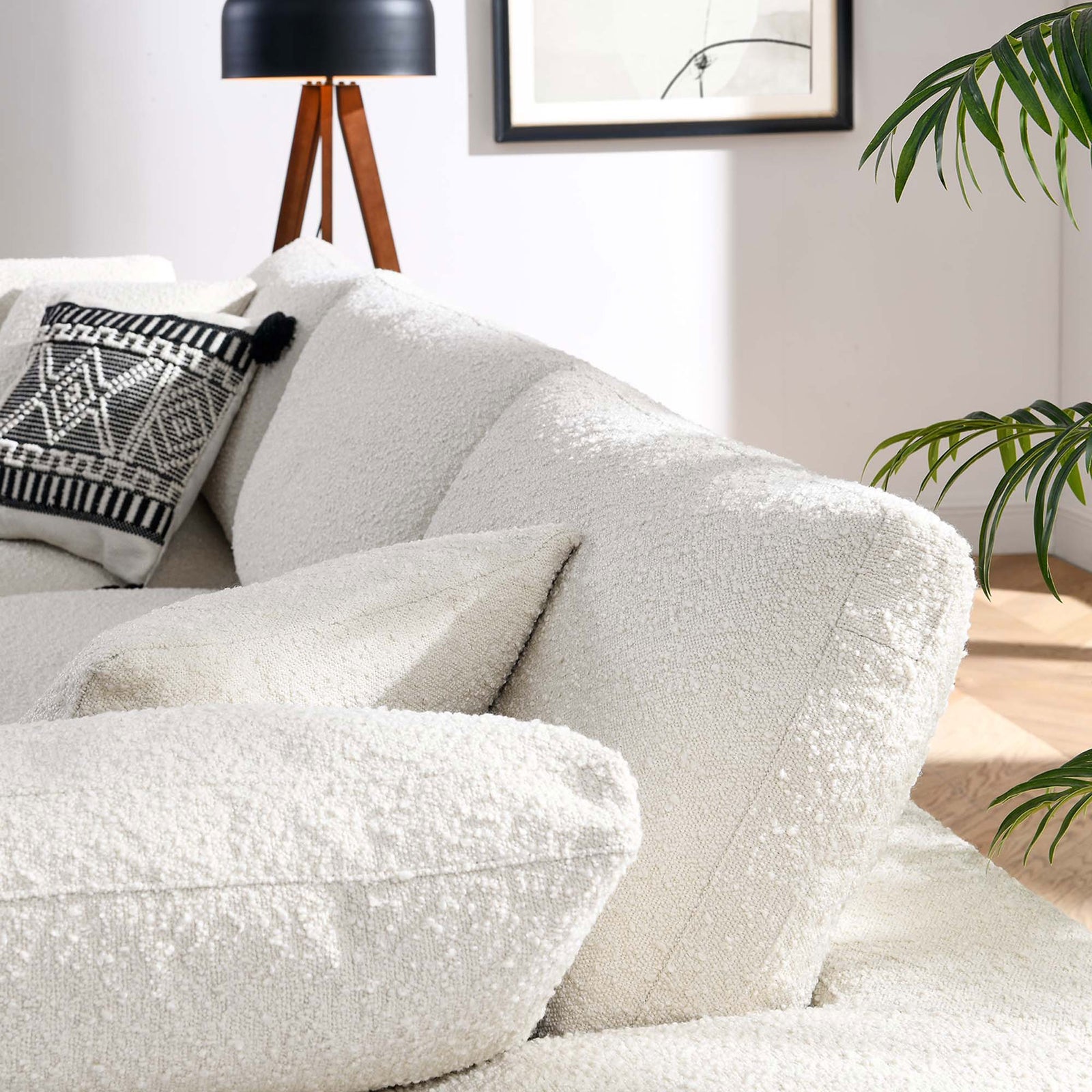 Ivory boucle sofa cushions showcasing deep seats and cozy texture in a bright living room || EEI-6362-IVO || detail_room