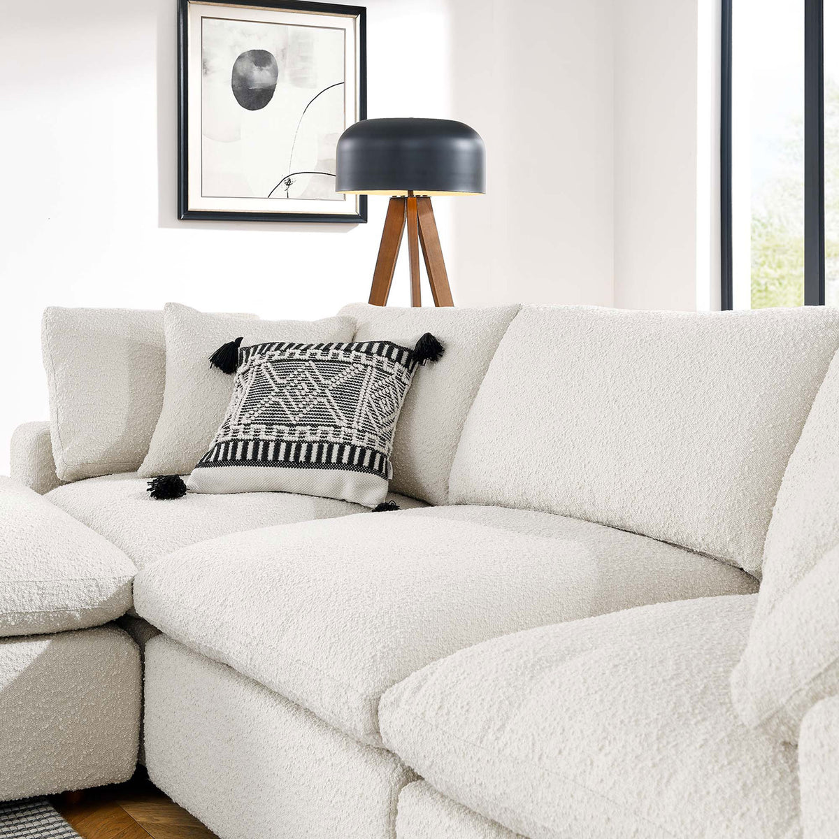 Soft ivory boucle cushions showcasing the nubby texture and layered pillows in a contemporary living room || EEI-6363-IVO || detail_room