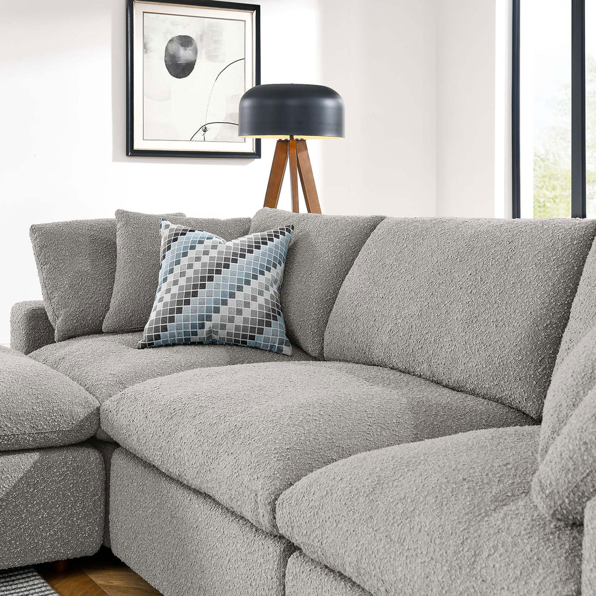 Cozy corner of light gray boucle sectional with plush back cushions and a patterned accent pillow || EEI-6363-LGR || detail_room