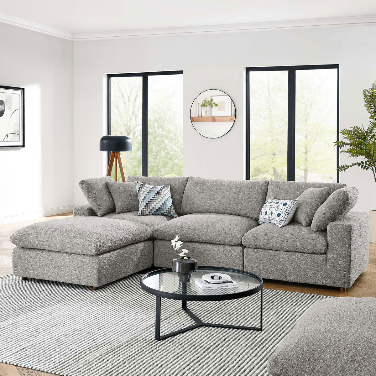 Commix light gray boucle sectional styled in a bright modern living space with a round coffee table || EEI-6363-LGR || front_angle_room