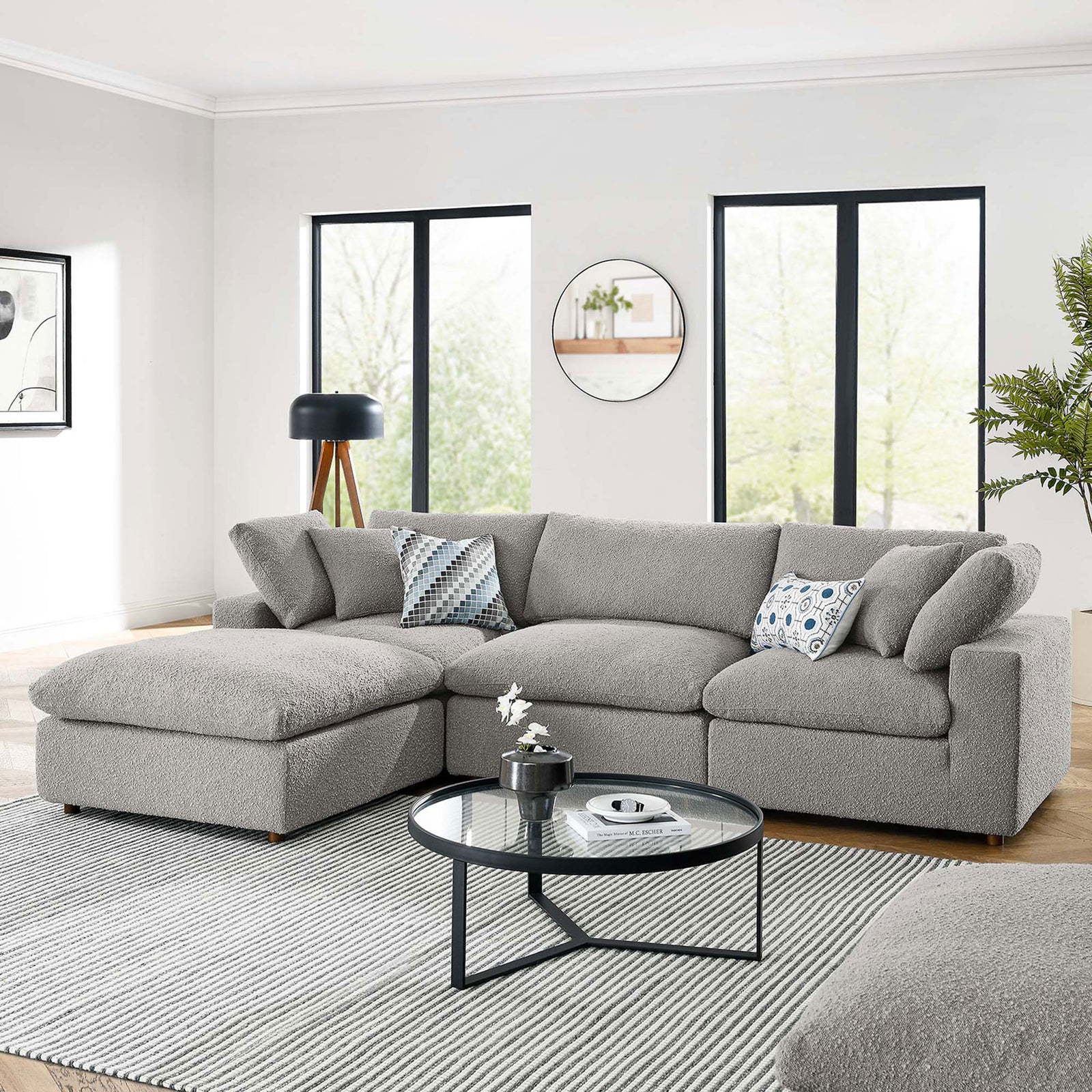 Commix light gray boucle sectional styled in a bright modern living space with a round coffee table || EEI-6363-LGR || front_angle_room