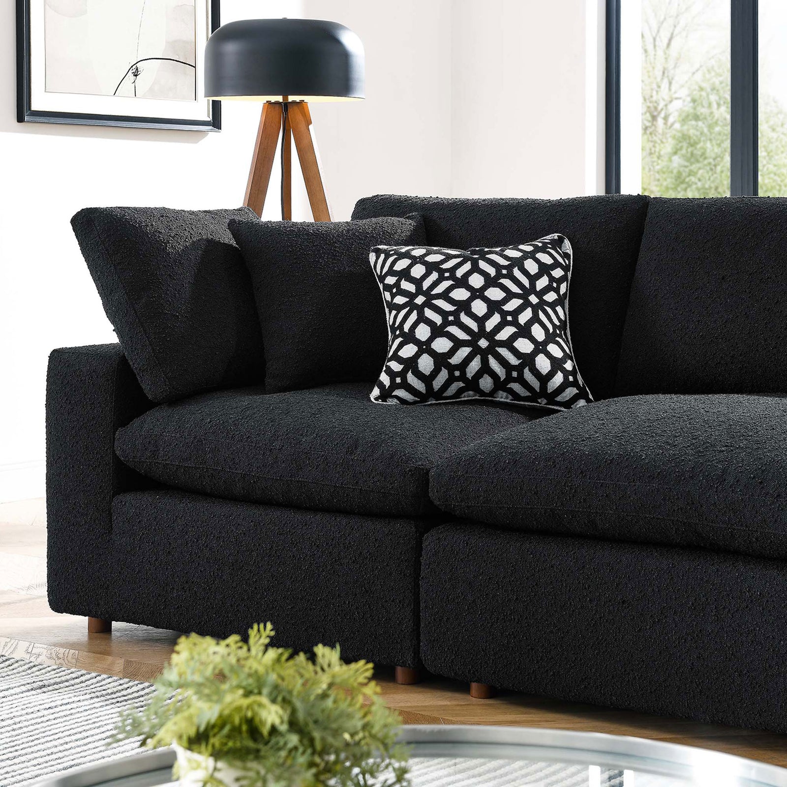 Cozy black boucle sofa corner highlighting rich texture, layered cushions, and a bold patterned pillow || EEI-6364-BLK || detail_room