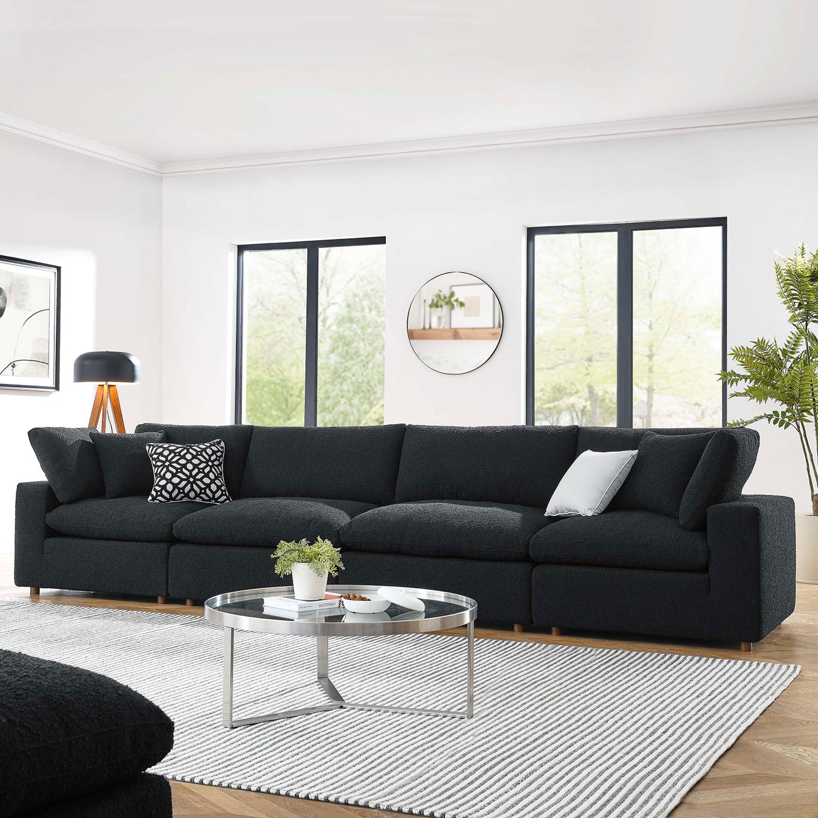 Black boucle 4-seat sofa styled in a bright living room with modern decor and a sleek round coffee table || EEI-6364-BLK || front_room