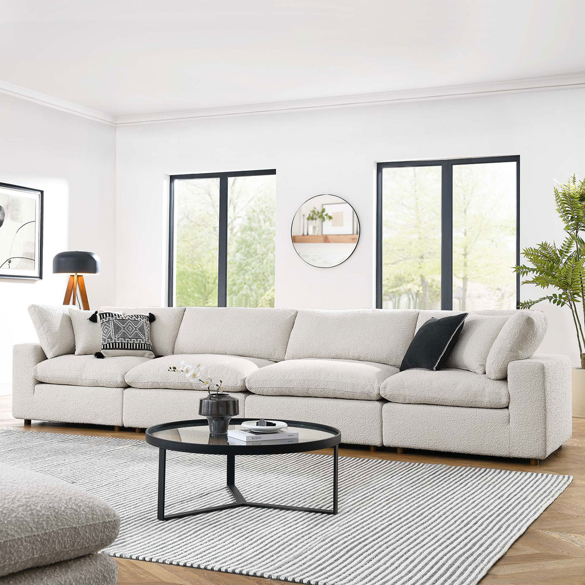 Ivory boucle 4-seater sofa styled in an airy modern living room with round black coffee table || EEI-6364-IVO || front_angle_room