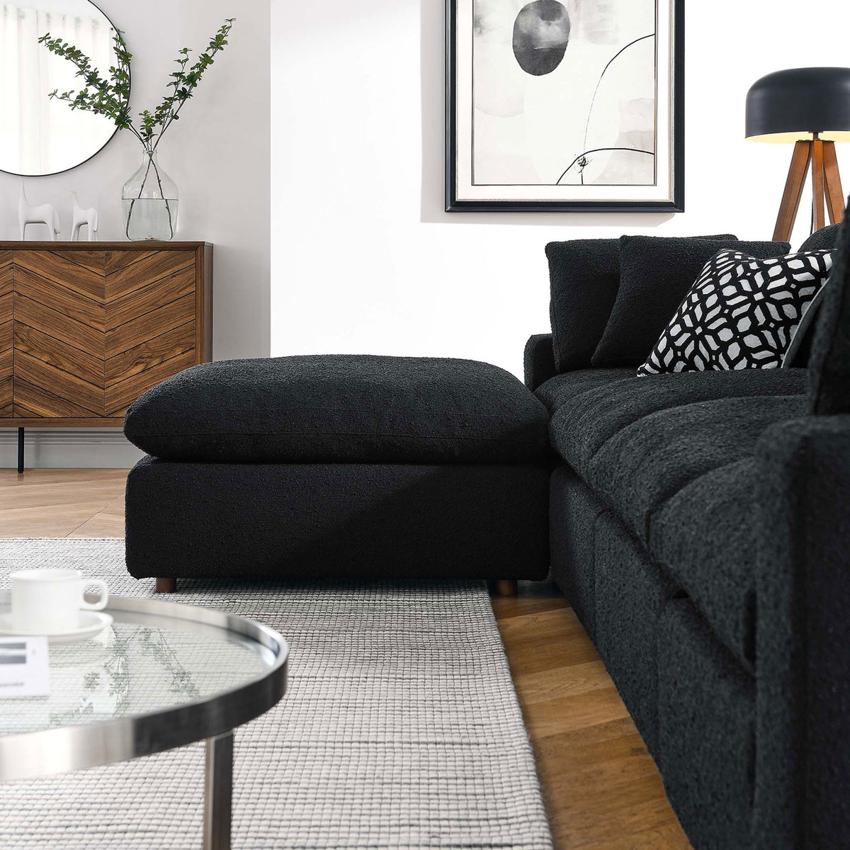 Cozy black boucle chaise section with plush cushions styled in a modern living room with warm wood accents || EEI-6365-BLK || detail_room