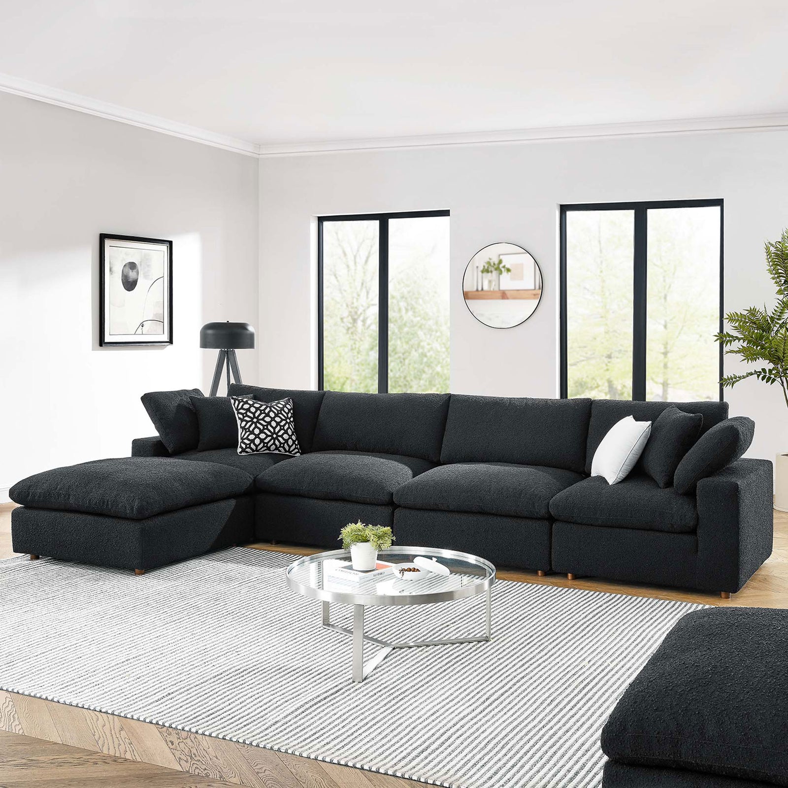 Spacious black boucle sectional sofa with chaise offering generous seating in a bright contemporary living room || EEI-6365-BLK || front_angle_room