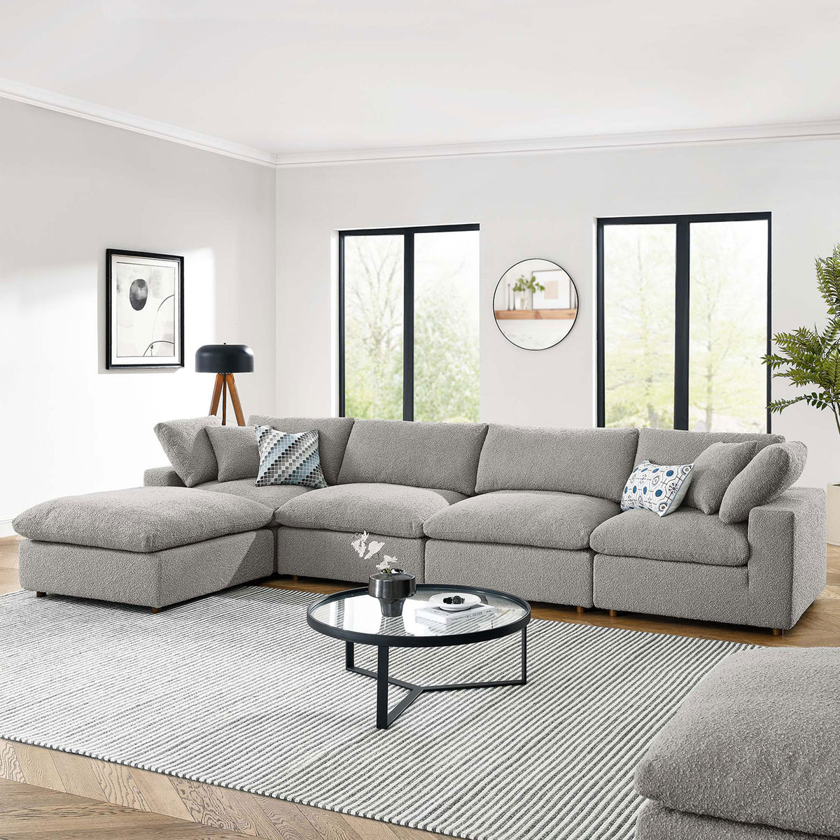Light gray boucle sectional with chaise in a bright living room with rug, round coffee table, and lamp. || EEI-6365-LGR || front_room
