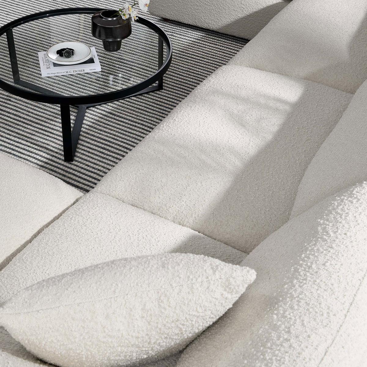 Close up of plush ivory boucle upholstery and cushions on the Commix sectional sofa || EEI-6366-IVO || swatch_room