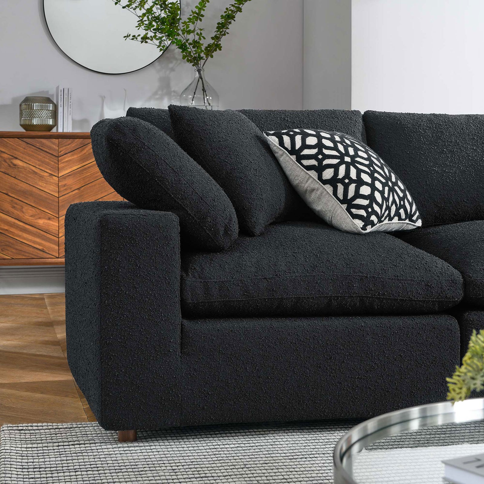 Styled corner of the black boucle sectional with layered accent pillows in a modern living room setting || EEI-6368-BLK || detail_room