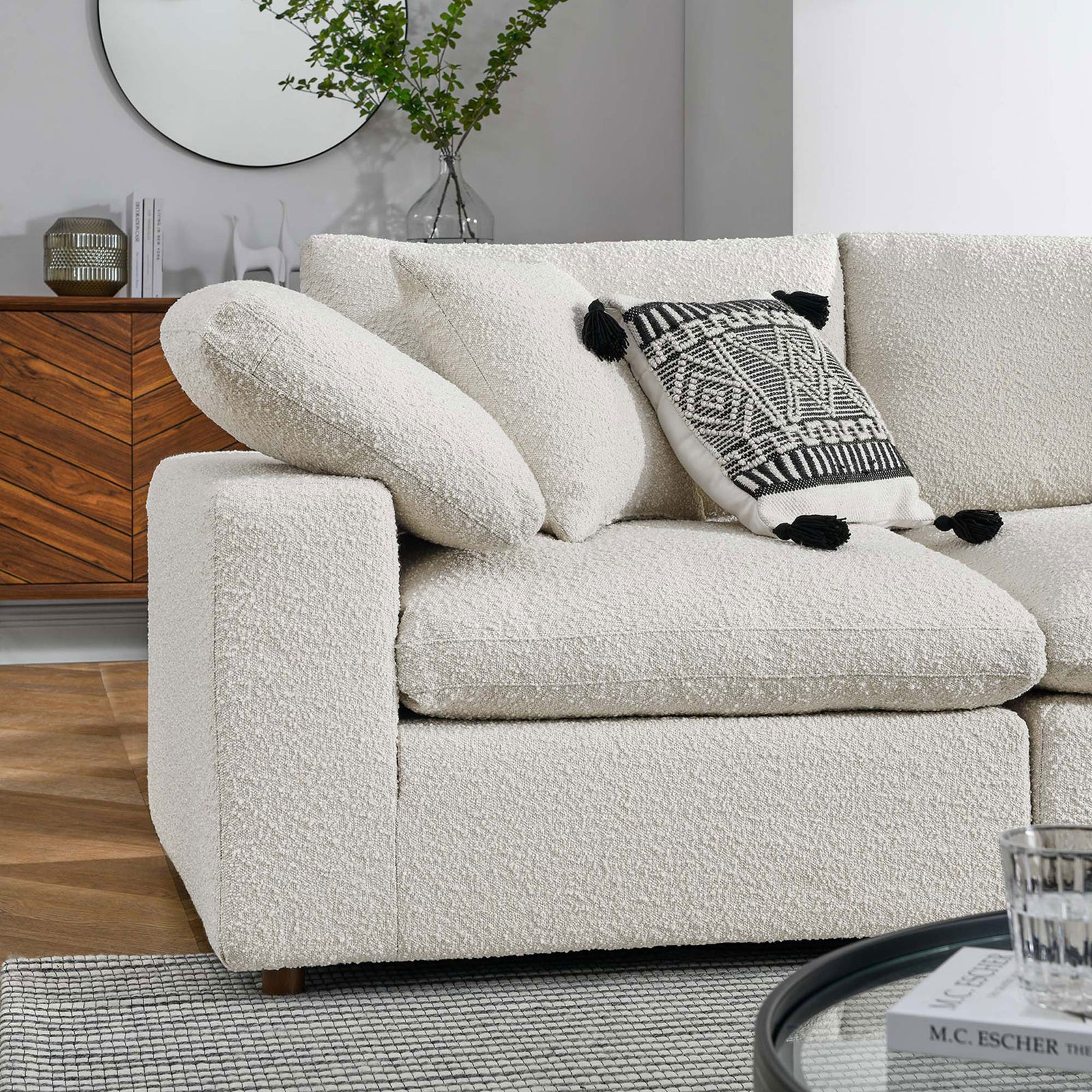 Soft ivory boucle cushions styled with a patterned accent pillow in a warm, modern living room || EEI-6368-IVO || detail_room