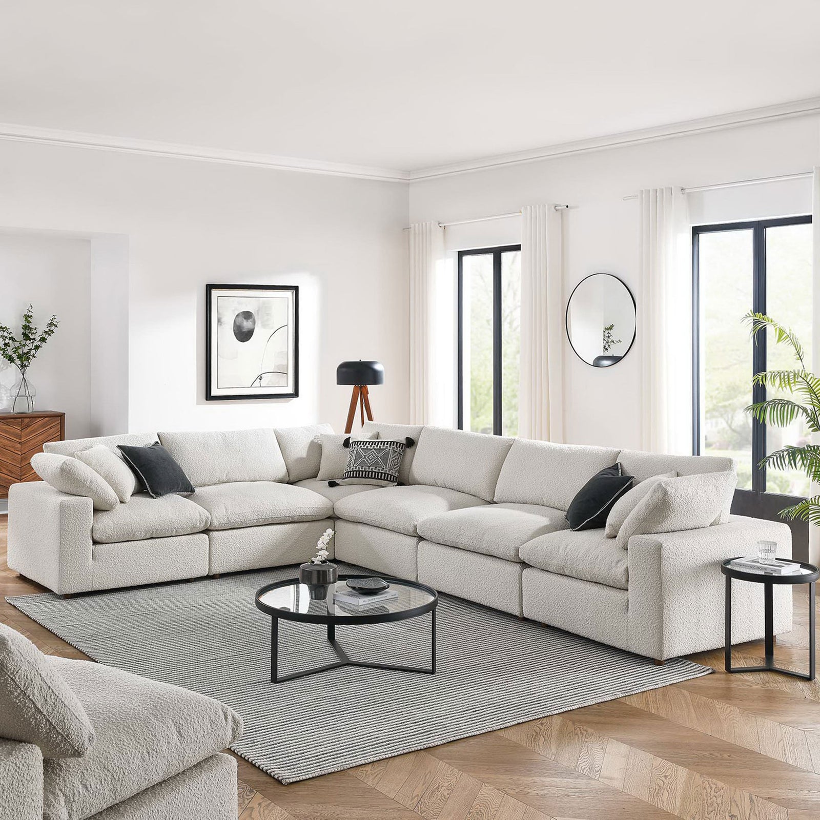 Large ivory boucle sectional styled in a bright living room with modern accents and a round coffee table || EEI-6369-IVO || front_angle_room