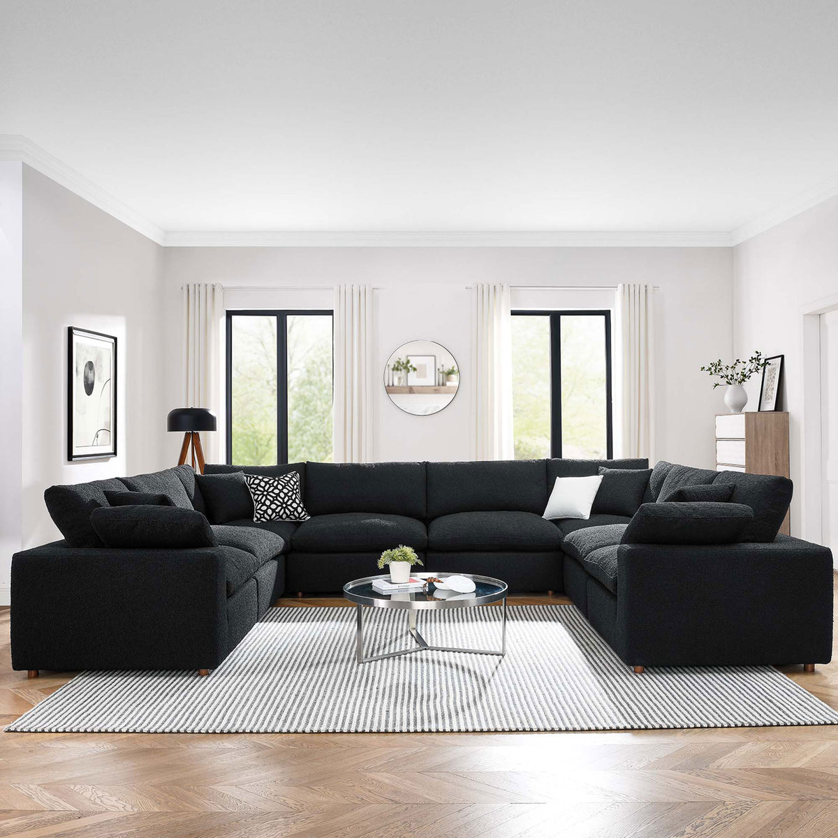 Spacious black boucle sectional sofa arranged for family lounging in an airy contemporary living room || EEI-6371-BLK || front_room