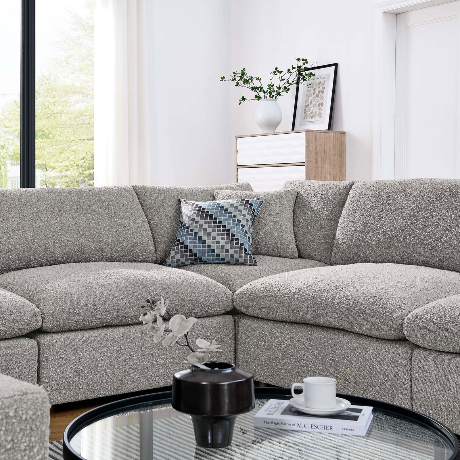 Inviting corner of the light gray boucle sectional styled with accent pillow and modern coffee table decor || EEI-6371-LGR || detail_room