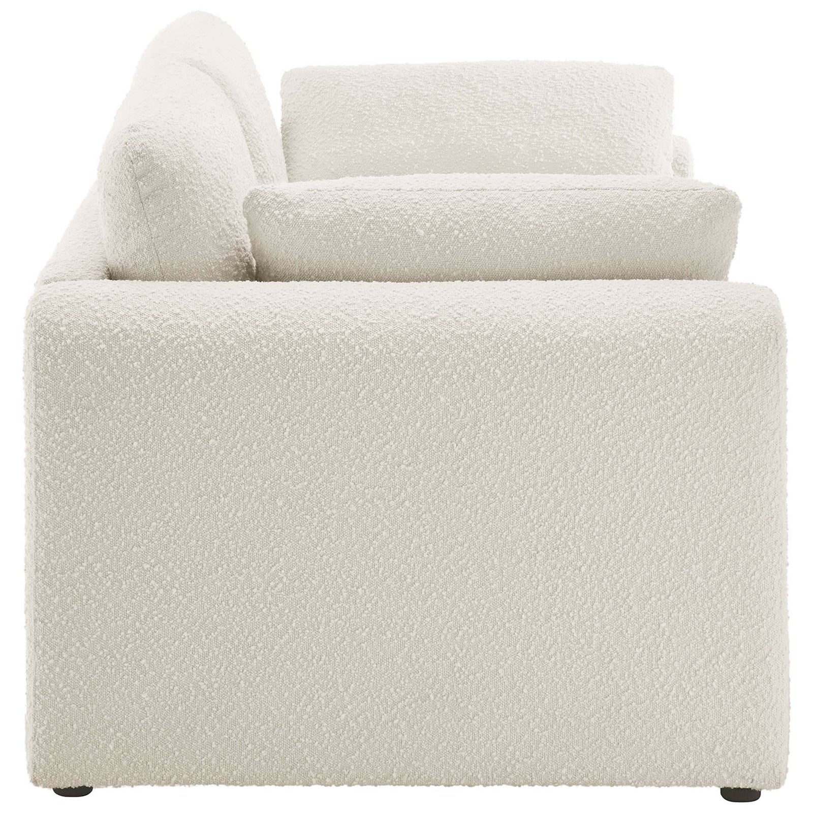 Sleek low-profile ivory sofa with boucle upholstery and thick back cushions for everyday comfort. || EEI-6381-IVO || side_studio