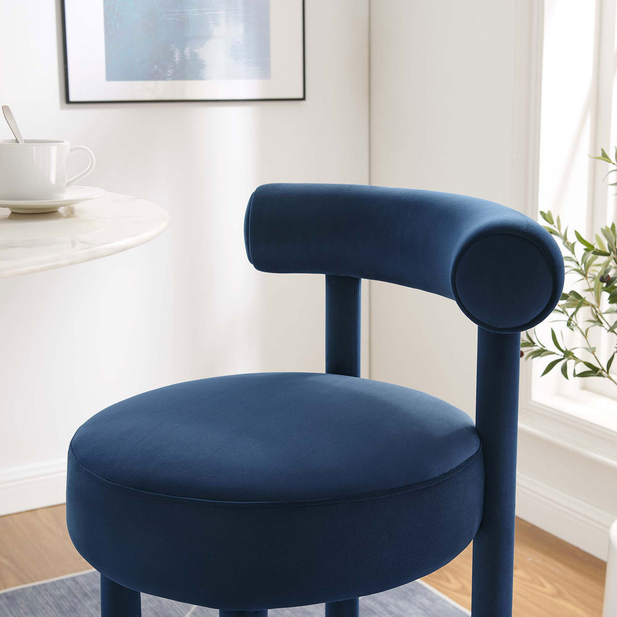 Upholstered bolster and cushioned seat bring support and style to bar seating || EEI-6386-MID-GLD || detail_room