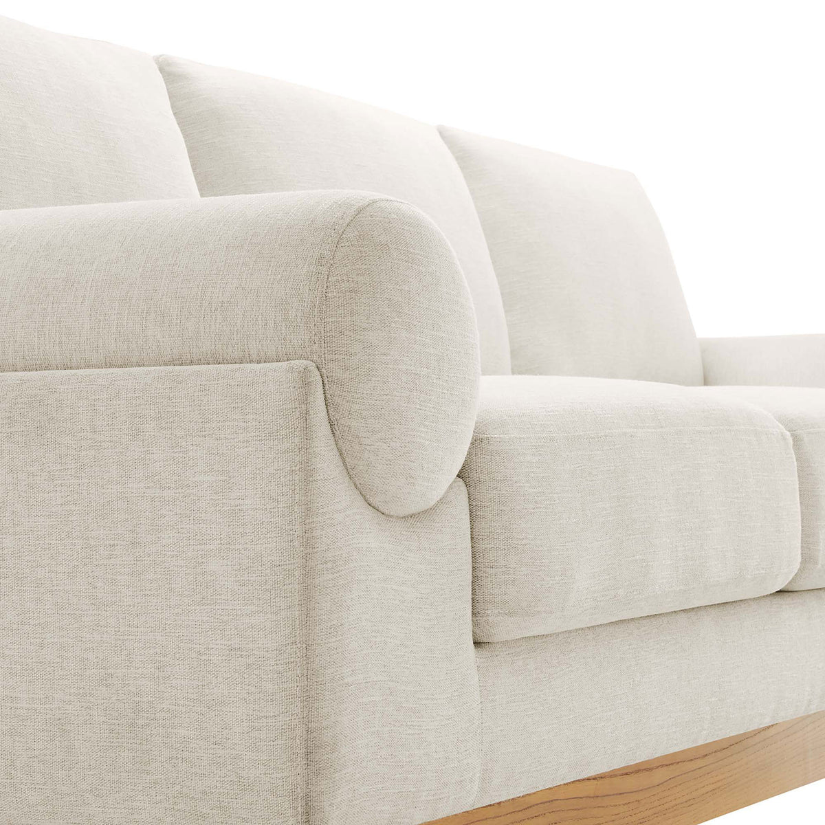 Bolster armrest and generously padded seat cushions on the ivory Oasis sofa || EEI-6401-IVO || detail_studio