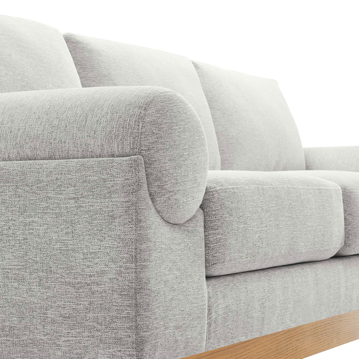Rounded bolster arm and textured light gray fabric bring soft, inviting comfort to the Oasis sofa || EEI-6401-LGR || detail_studio