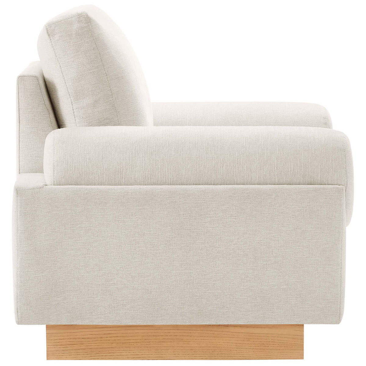 Streamlined silhouette with plush seat and bolster armrests atop a warm wood plinth base || EEI-6402-IVO || side_studio