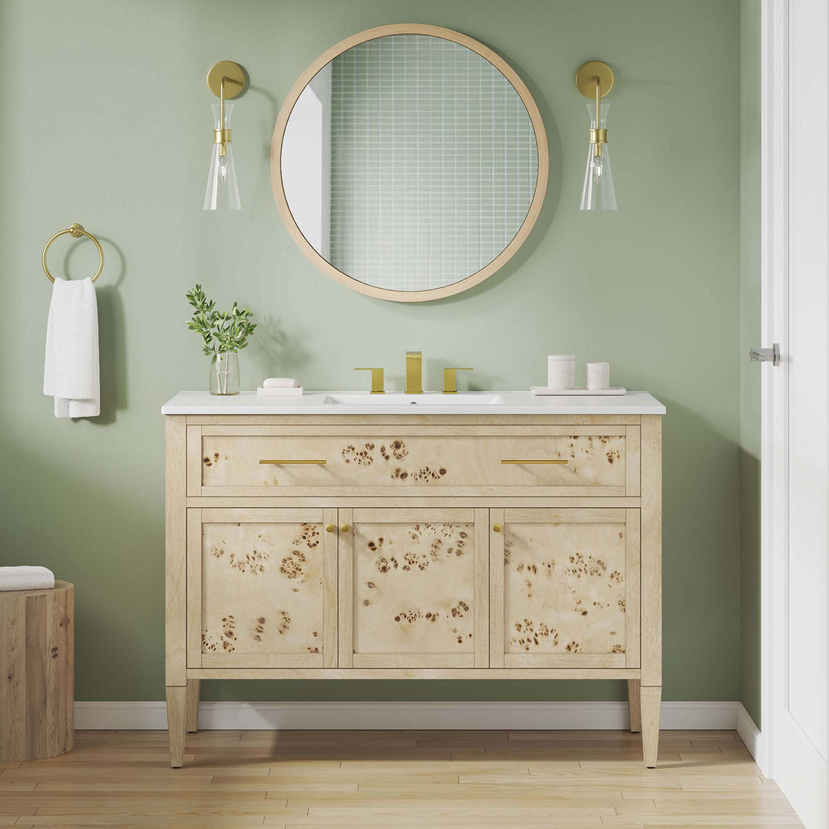 Warm burl wood vanity elevates the bath with a crisp white top and modern brass hardware. || EEI-6451-WHI-BUR || front_room
