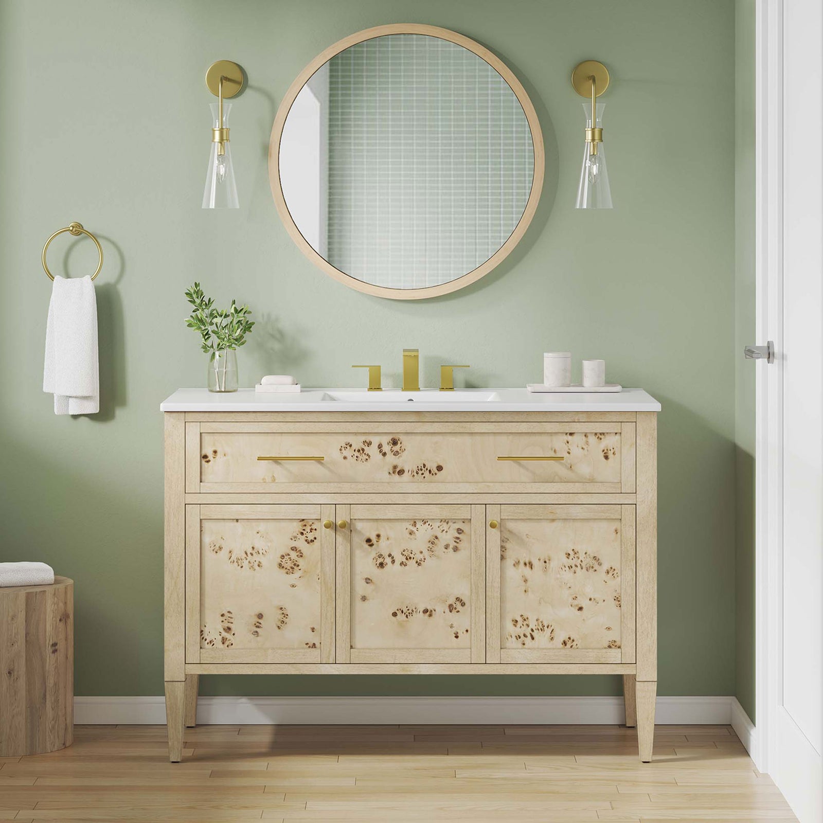 Warm burl wood vanity elevates the bath with a crisp white top and modern brass hardware. || EEI-6451-WHI-BUR || front_room
