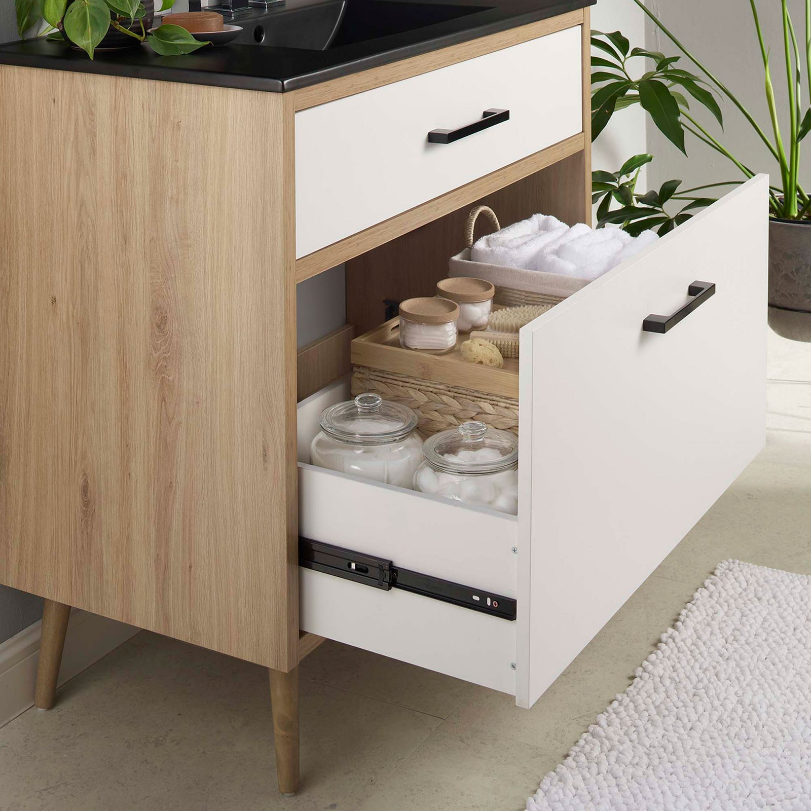 Extra-wide bottom drawer neatly stores bath essentials for clutter-free living || EEI-6501-BLK-OAK || storage_open_room