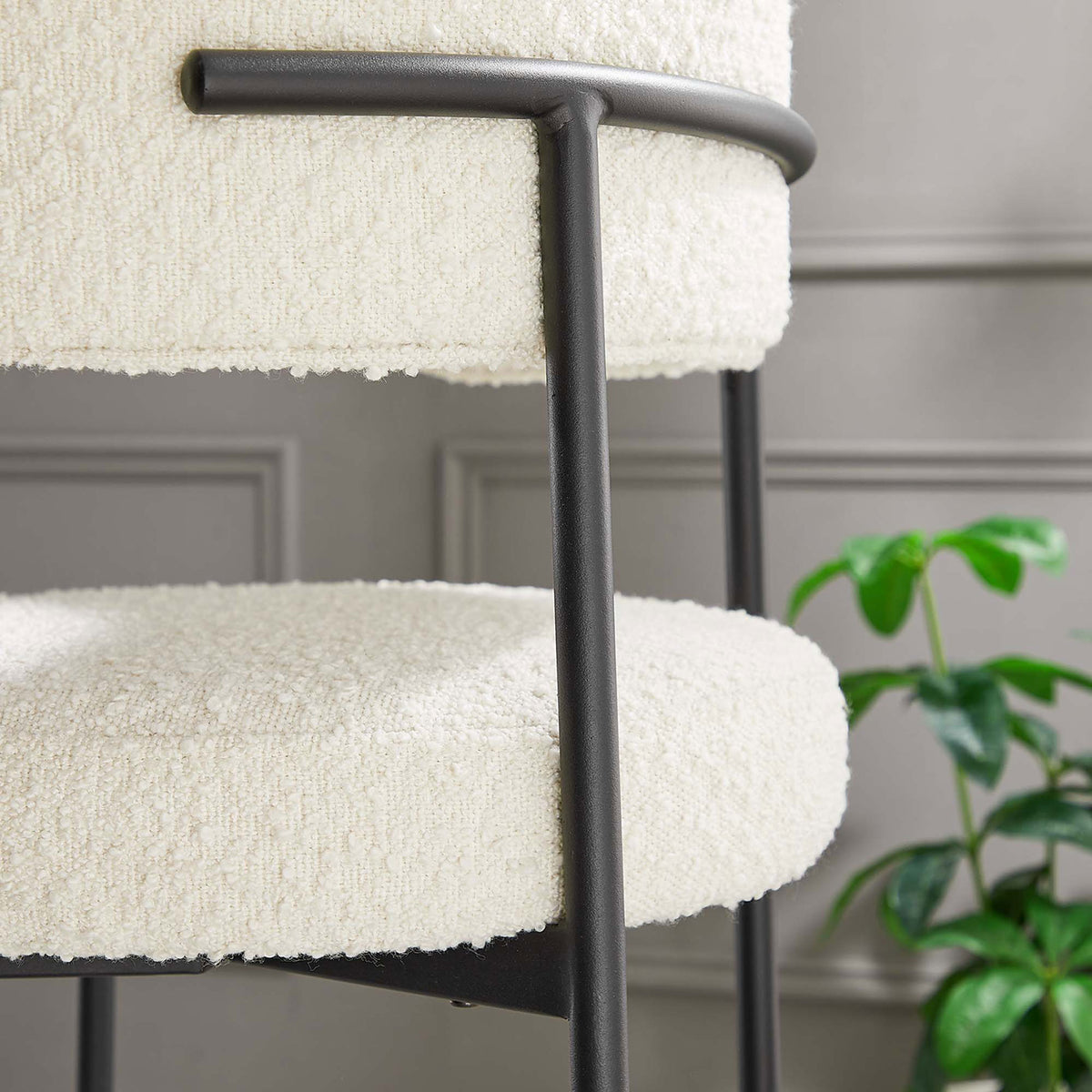 Boucle texture and matte frame complement refined dining decor. || EEI-6520-IVO-BLK || detail_room