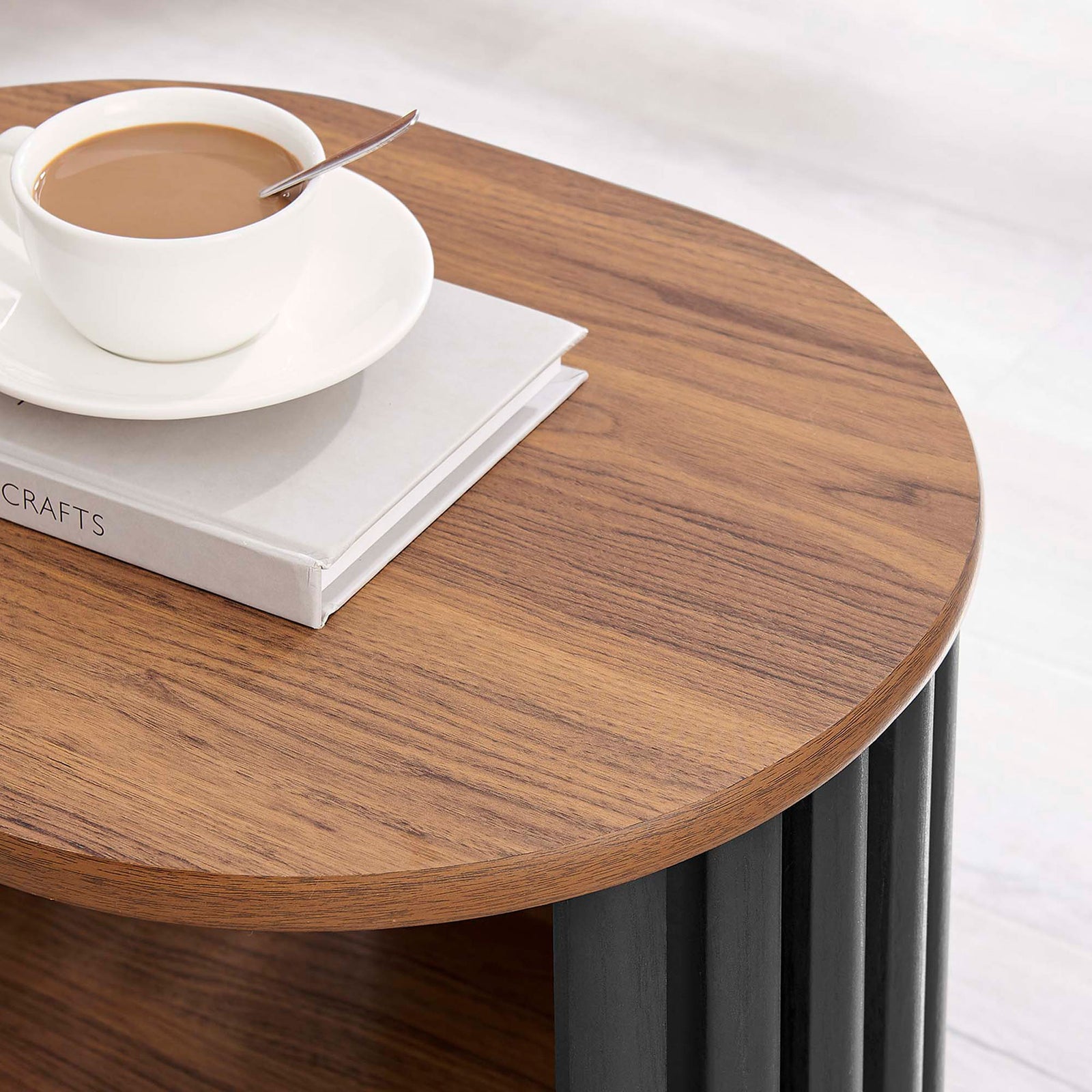 Walnut side table top styled with a book and coffee cup, showing the warm wood grain finish || EEI-6523-WAL-BLK || detail_room