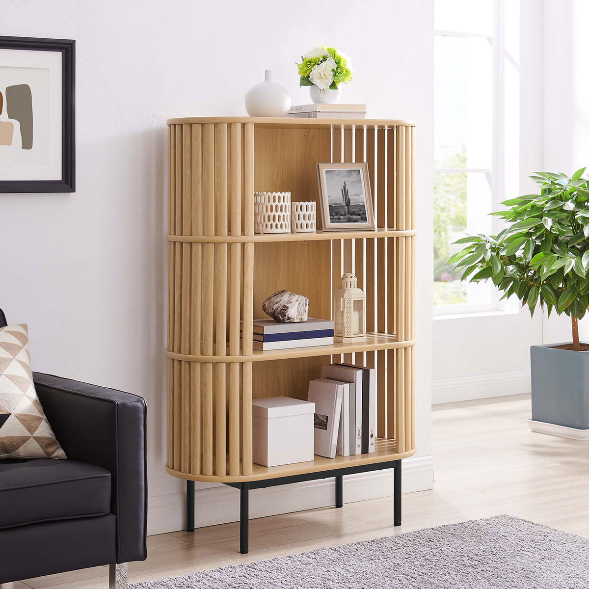 Versatile three-tier oak bookshelf elevates decor with open storage and airy slatted design || EEI-6524-OAK || front_angle_room