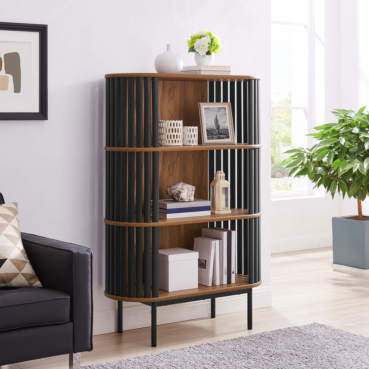 Three-tier walnut display cabinet brings warm texture and open storage to a bright, contemporary living space || EEI-6524-WAL-BLK || front_angle_room