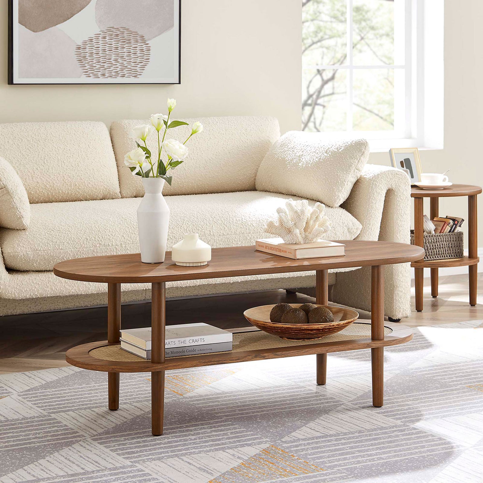 Mid-century charm meets coastal flair with rounded legs and a woven rattan shelf. || EEI-6526-WAL || front_angle_room