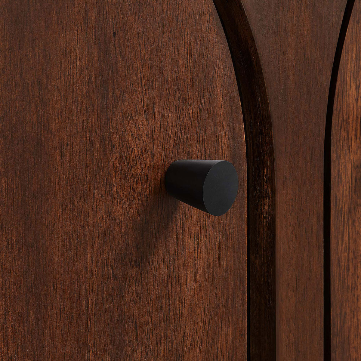 Matte black knobs pop against the walnut finish for a crisp, modern accent || EEI-6537-WAL || handle_studio