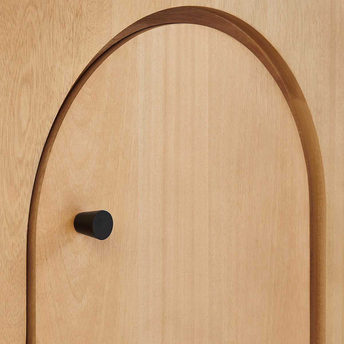 Oak veneer arch detail with matte black knob adding modern contrast against the warm wood grain || EEI-6538-OAK || handle_studio