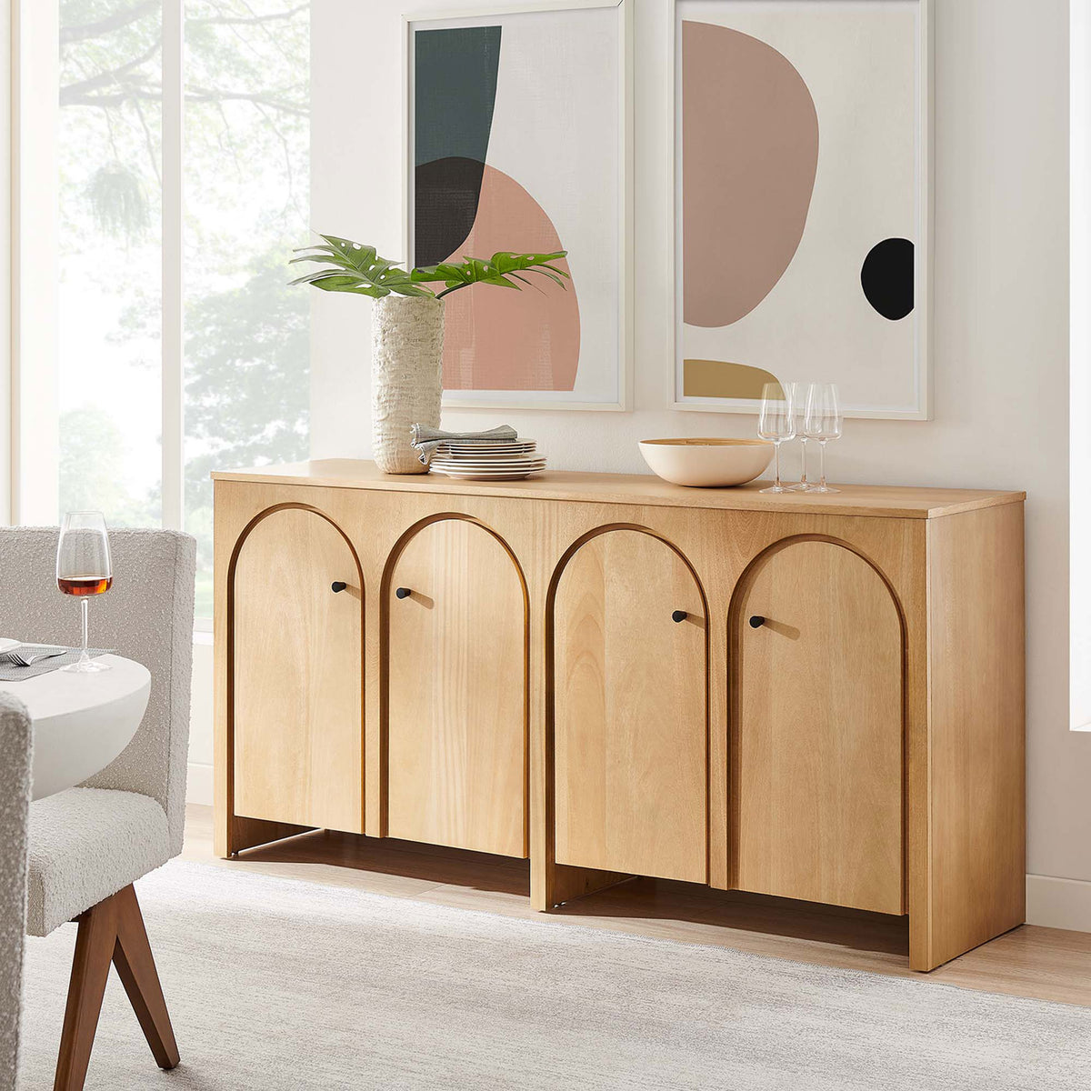Oak Appia sideboard styled in a bright dining room, offering generous storage and a spacious display surface || EEI-6538-OAK || front_angle_room