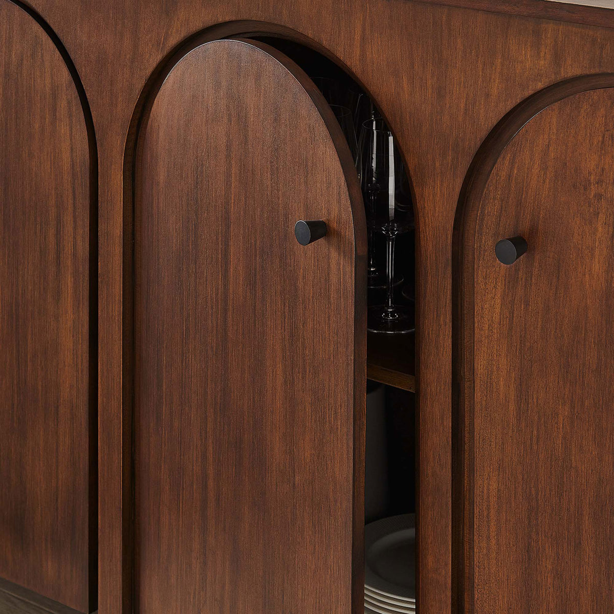 Walnut sideboard doors reveal neatly organized dishes and glassware on adjustable shelves || EEI-6538-WAL || storage_open_room