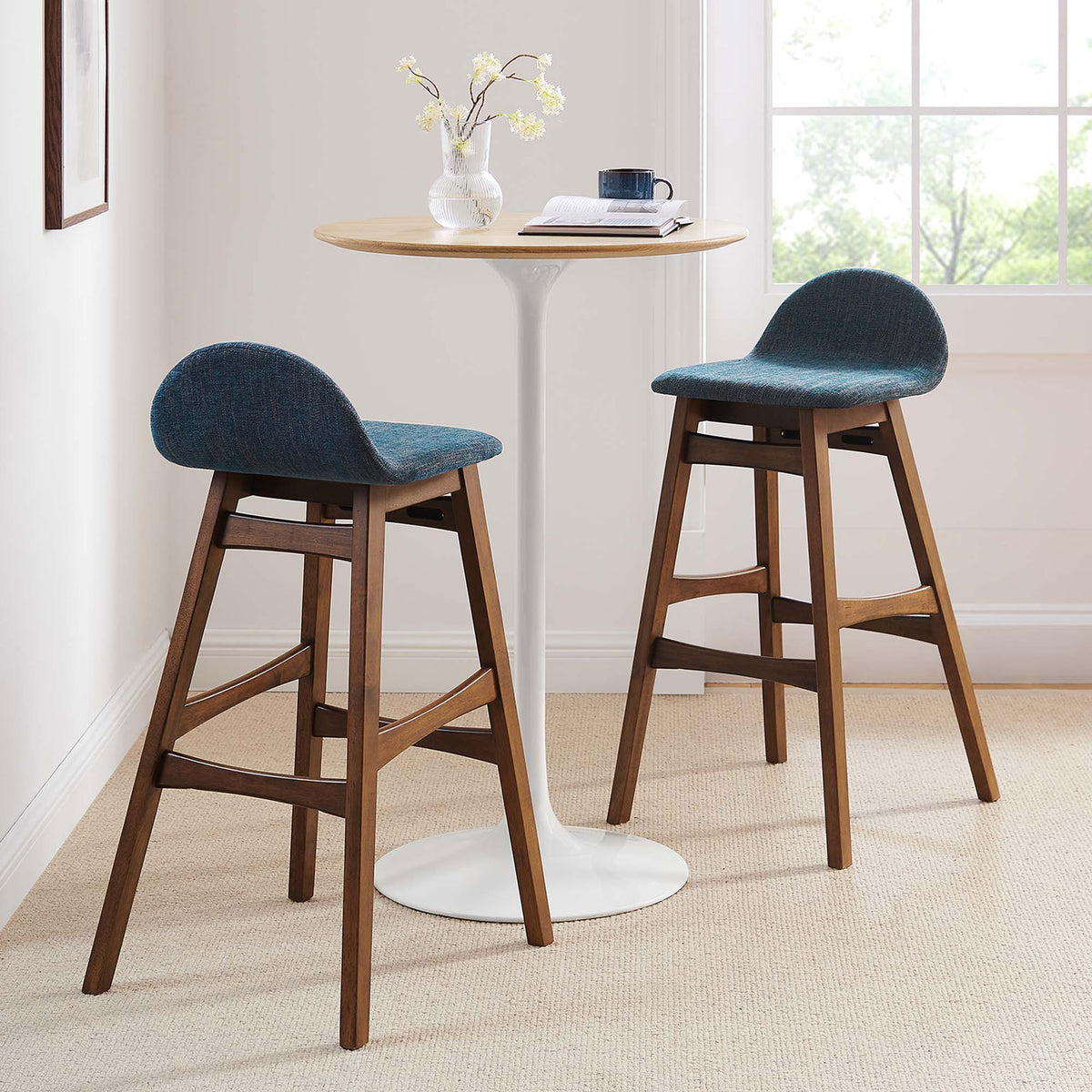 A coordinated pair elevates casual gatherings with supportive seats and warm wood. || EEI-6553-HEA || front_angle_multi_room