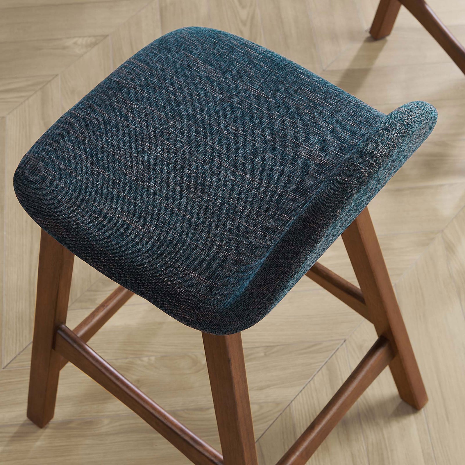 Heathered navy fabric and smooth curves add a soft, tailored look to the seat. || EEI-6555-HEA || detail_room