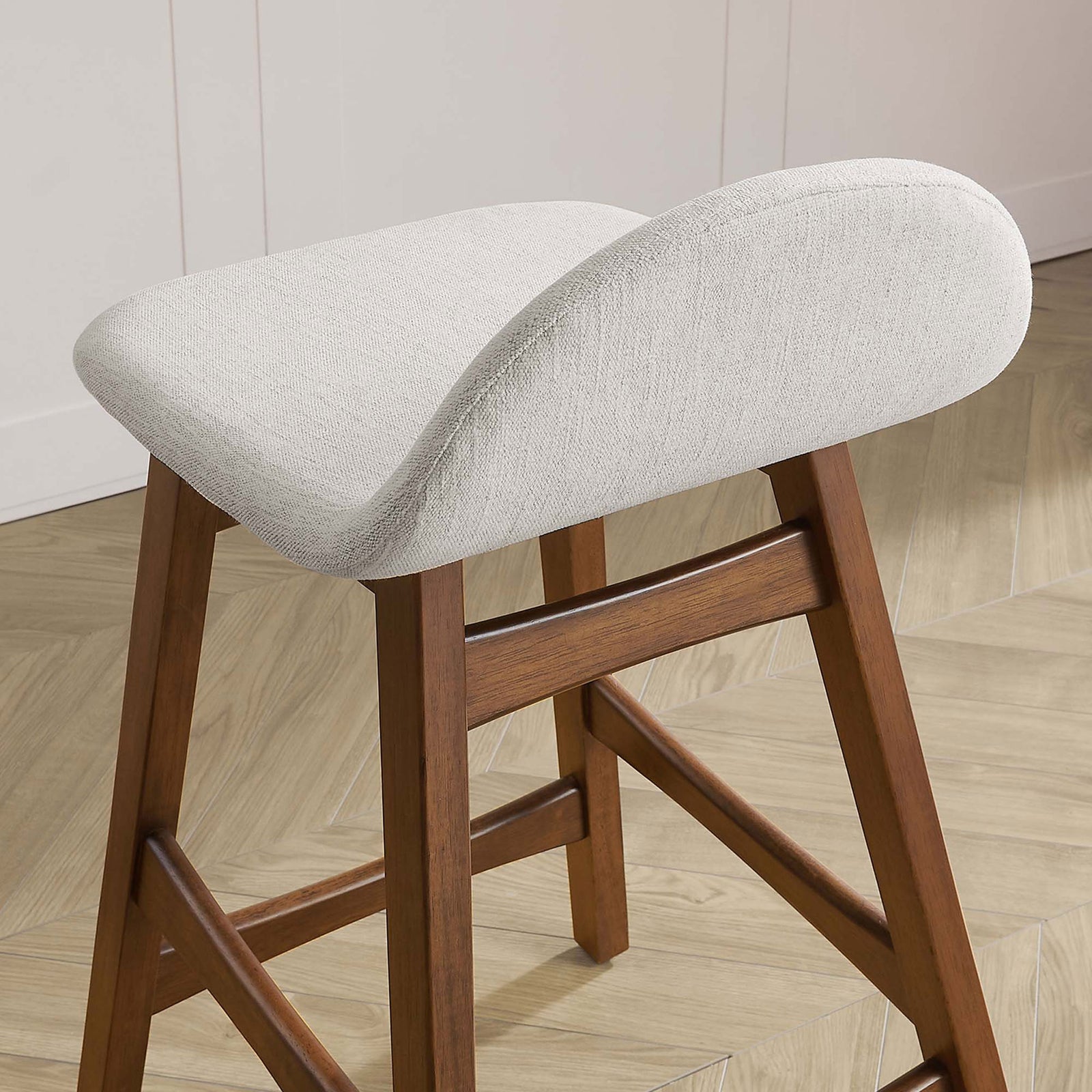 Textured ivory seat and gentle curve complementing the wood base in a modern kitchen || EEI-6555-HEI || detail_room