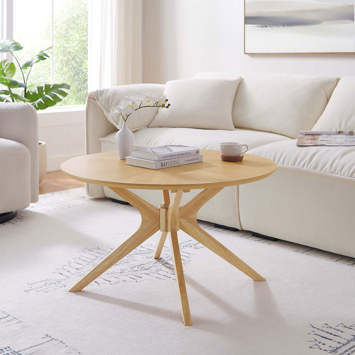 Mid-century profile with sculptural legs elevates the space with a light, inviting oak finish || EEI-6557-OAK || front_angle_room