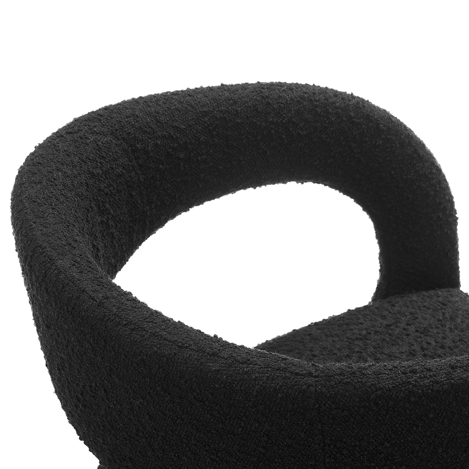Nubby black boucle upholstery and smoothly curved armrest detail bring tactile luxury to this dining chair. || EEI-6562-BLK || detail_studio