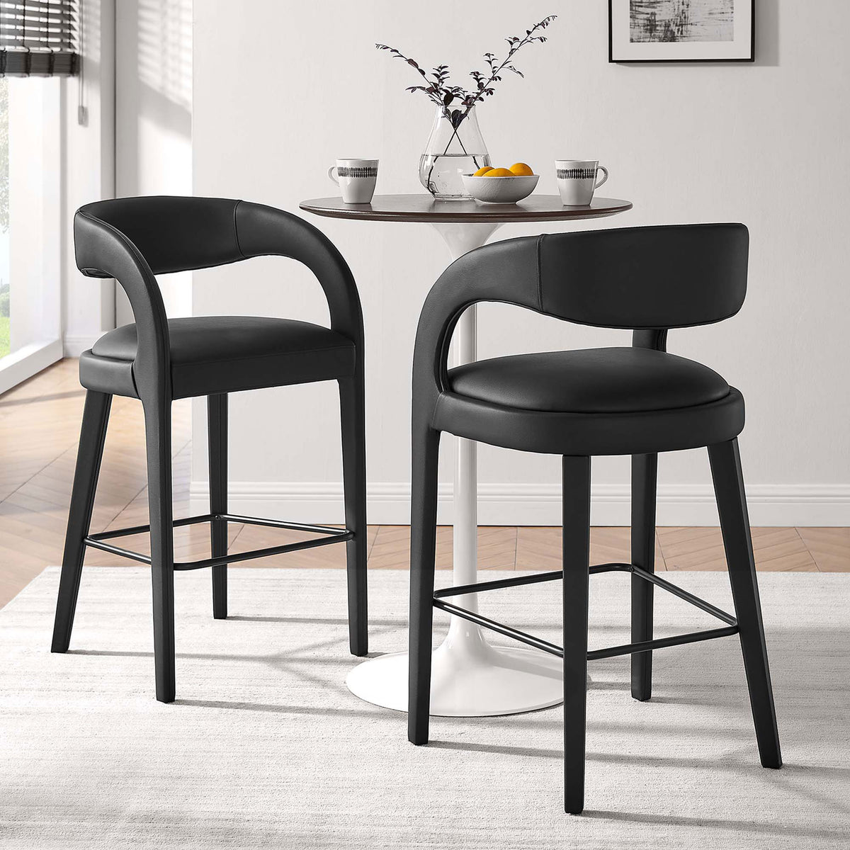 Pair of bar stools elevate a cozy dining nook with cushioned seats and curved backs || EEI-6567-BLK-BLK || front_angle_multi_room