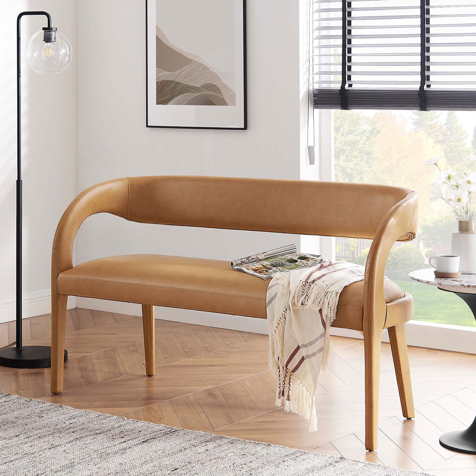 Modern tan bench elevates living spaces with sculptural curves and cushioned comfort || EEI-6570-TAN || front_angle_room