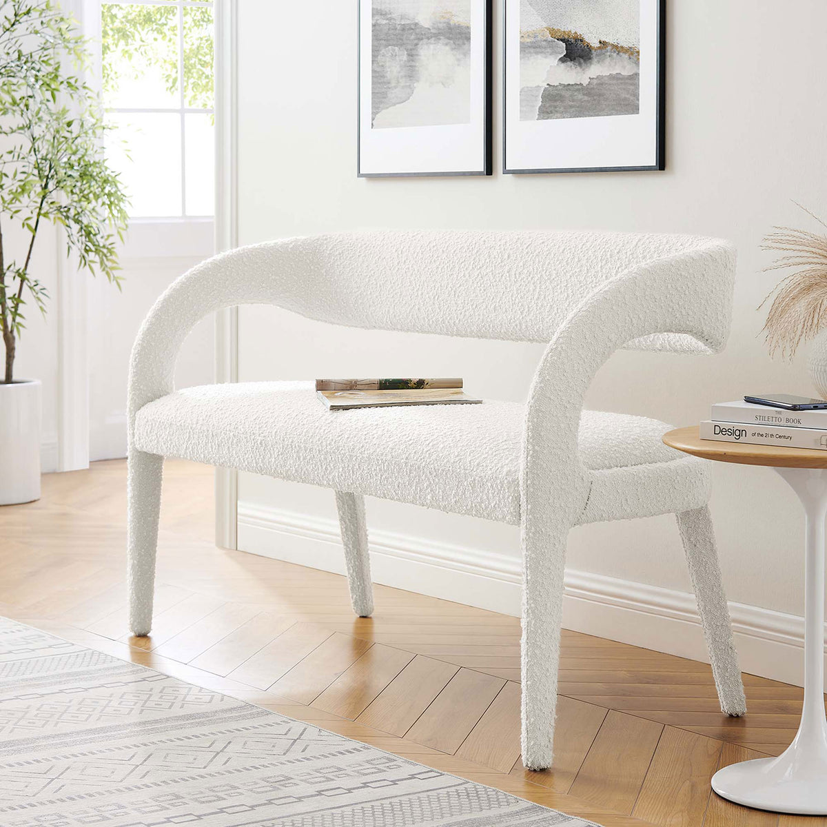 Stylish ivory boucle bench elevates seating with an open-back curve and minimalist legs. || EEI-6571-IVO || front_angle_room