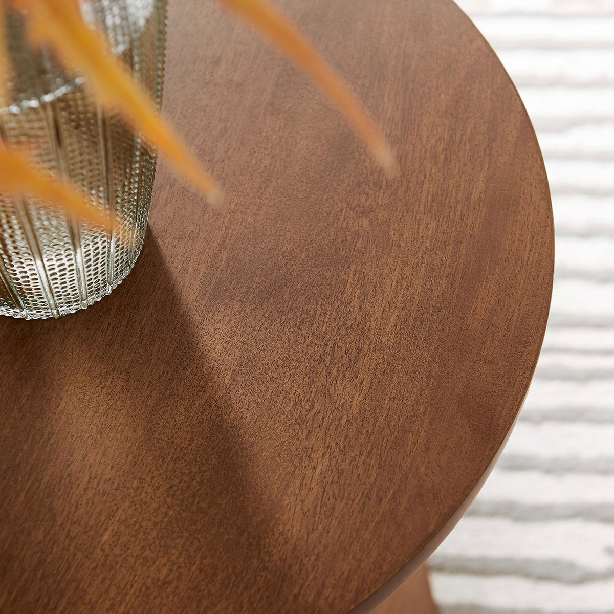 Walnut side table tabletop styled with textured glass vase and foliage over a light neutral rug || EEI-6573-WAL || detail_room