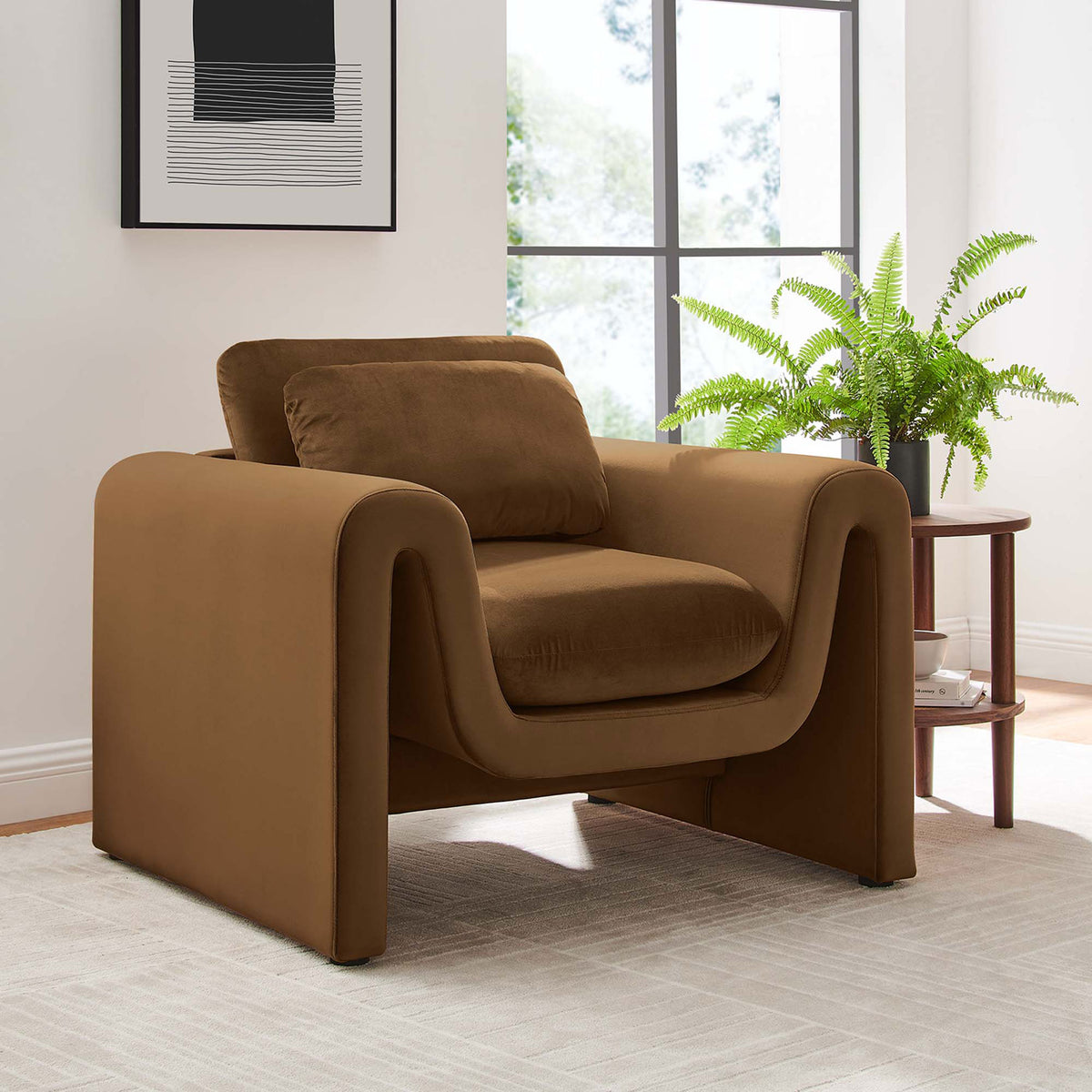 Modern brown velvet armchair brings sculptural curves to a bright, inviting living space || EEI-6576-BRN || front_angle_room