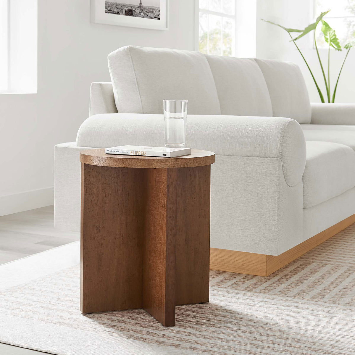 Walnut round side table beside a modern sofa, adding warm wood contrast to the living room || EEI-6579-WAL || front_angle_room
