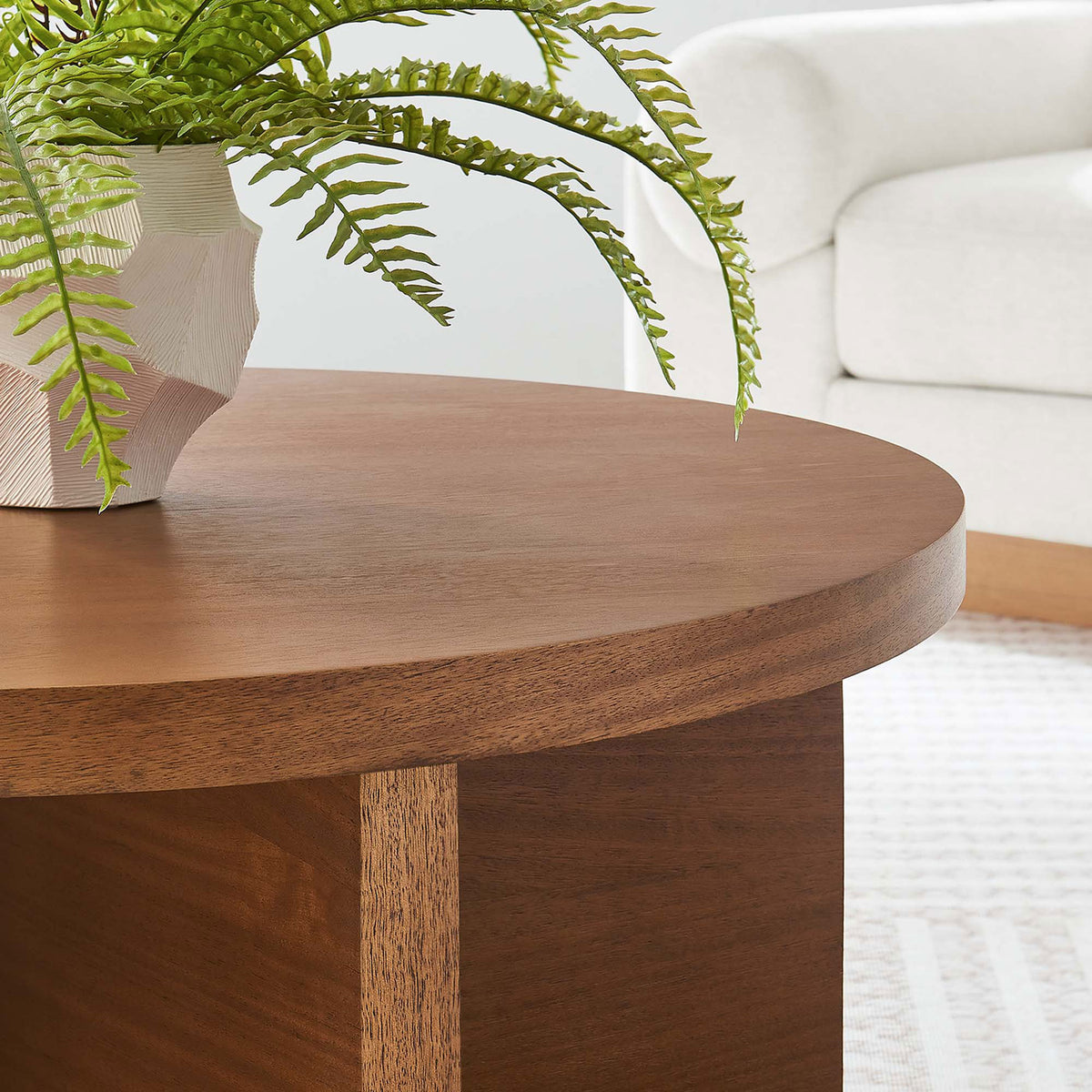 Rich walnut finish and natural grain bring warmth to modern living spaces || EEI-6580-WAL || detail_room