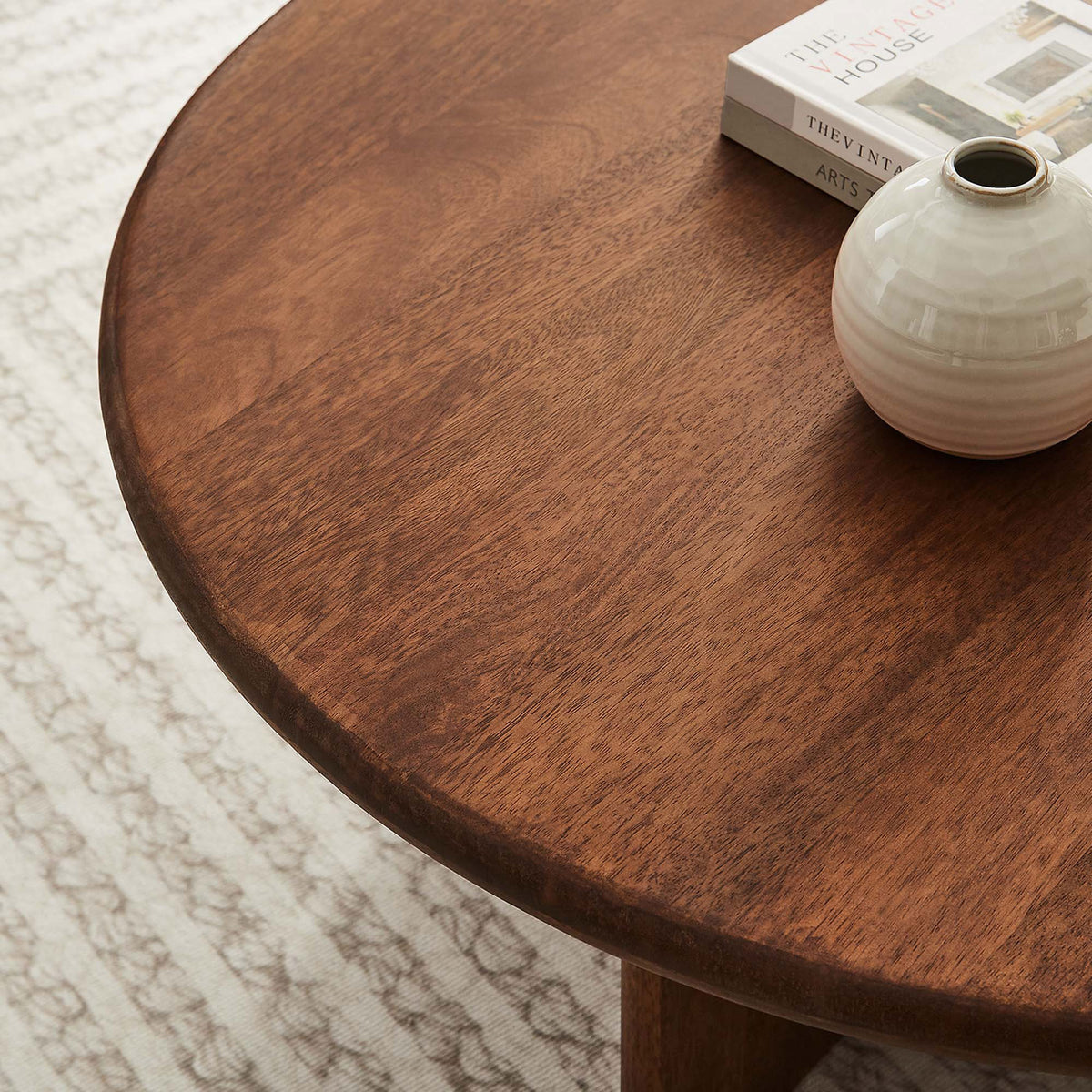 Rich walnut grain and a softly rounded edge bring warmth and texture to the tabletop || EEI-6594-WAL || detail_room