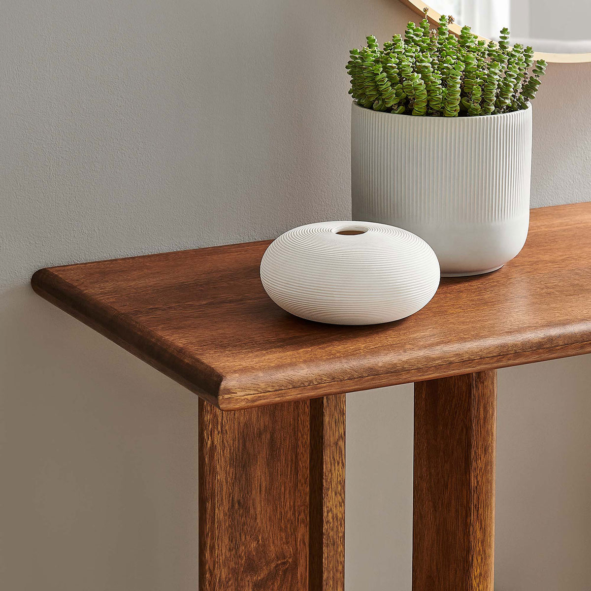 Smooth walnut tabletop offers a welcoming landing spot for keys, plants, and decorative accents || EEI-6596-WAL || detail_room
