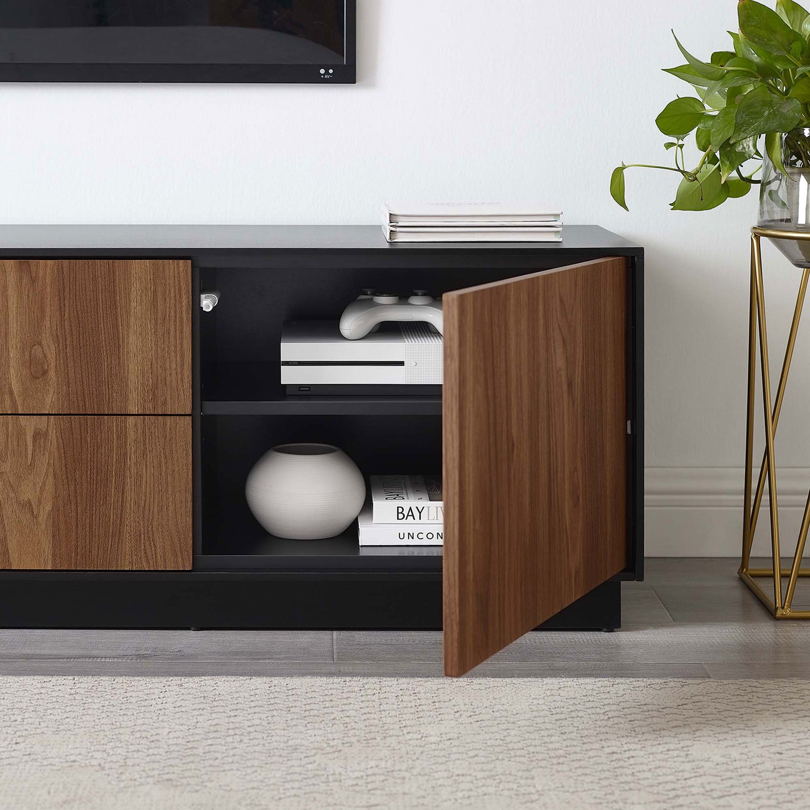 Holden TV stand in a modern living room with open cabinet displaying media devices || EEI-6598-BLK-WAL || front_angle_open_room