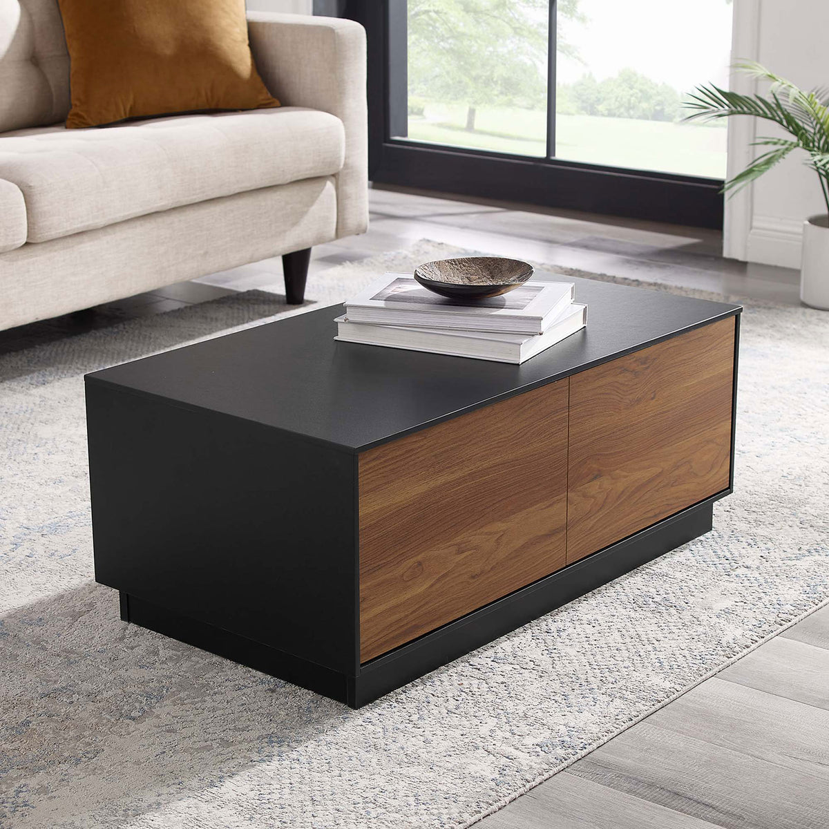 Modern coffee table anchors the living room with a black top and walnut drawer fronts || EEI-6599-BLK-WAL || front_angle_room